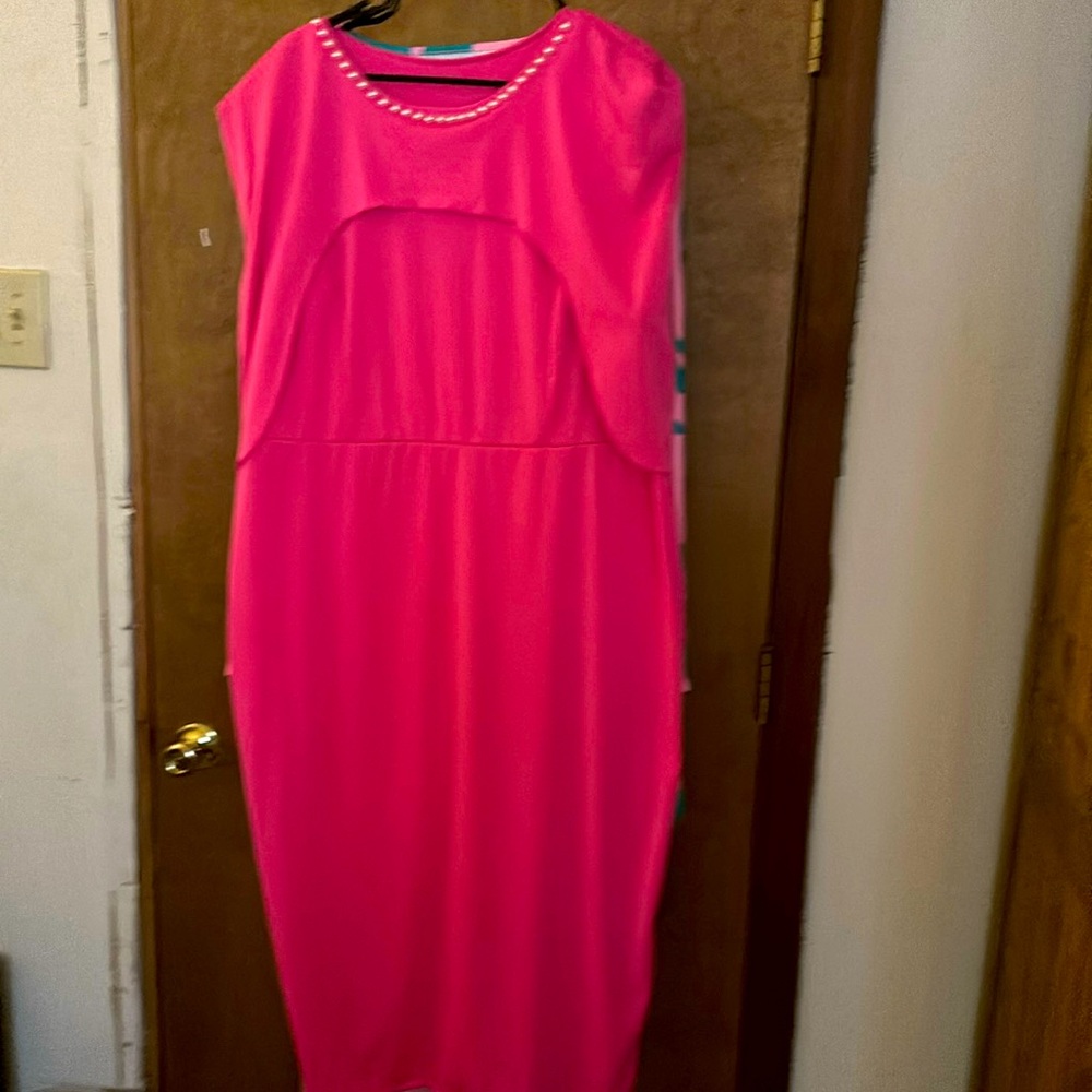 Beautiful pink dress with pearls attached to the neckline of the dress